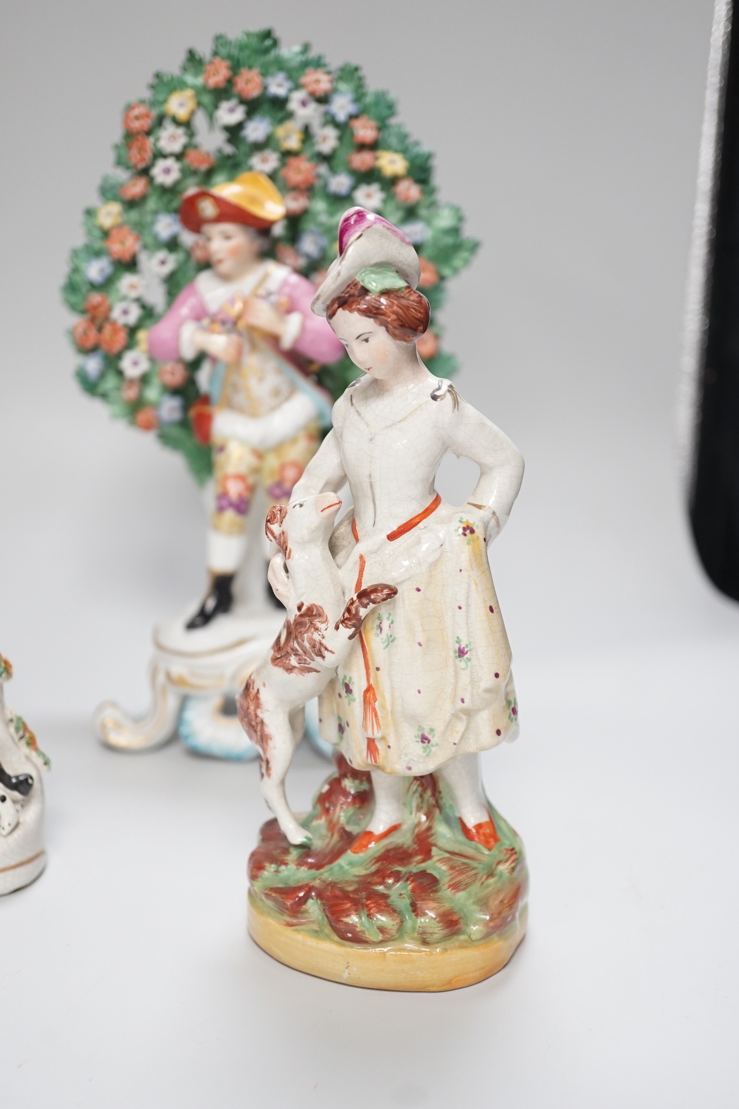 A pair of Derby style bocage figures and three other figures, tallest 26cms high